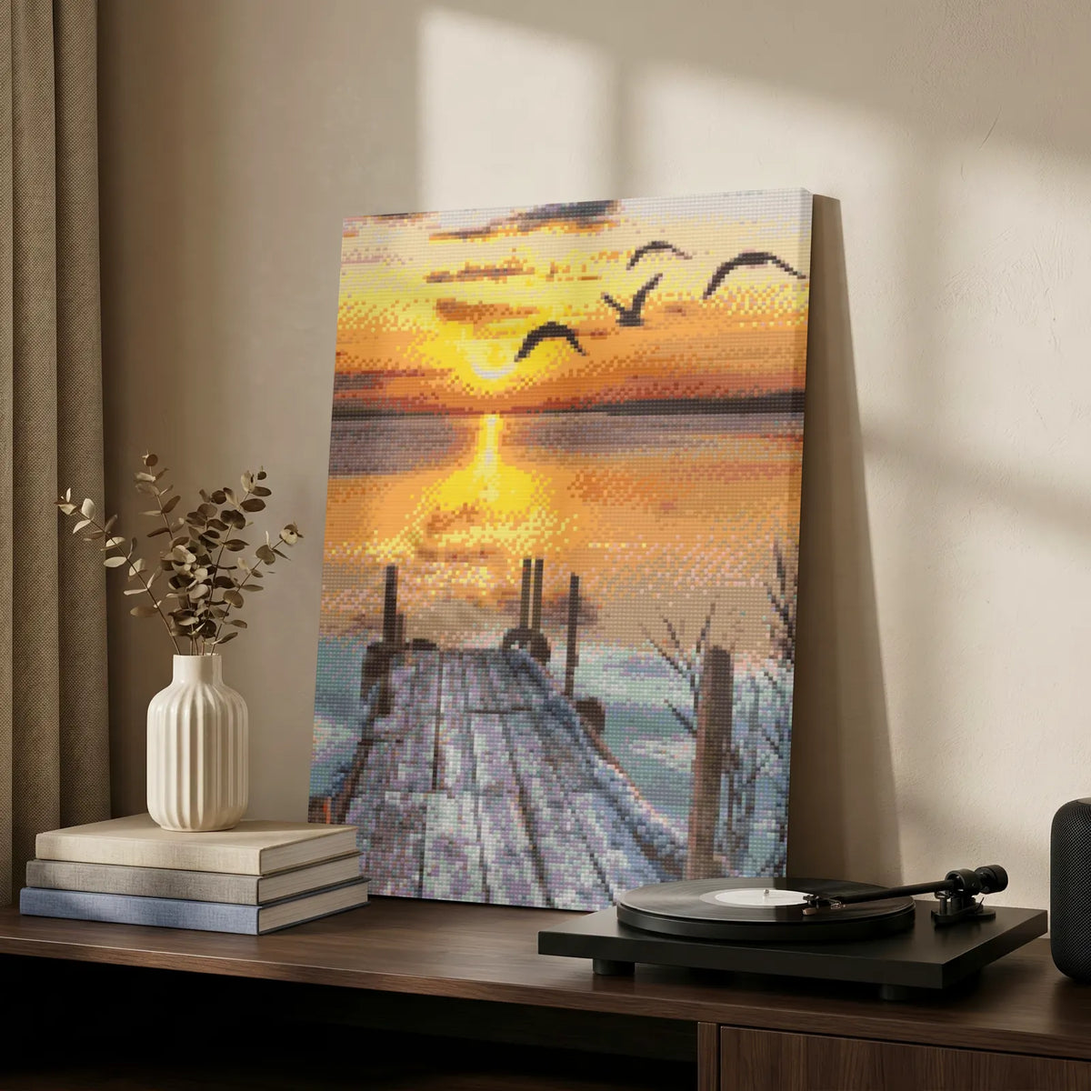 Winter jetty at golden hour diamond painting on a sideboard beside a record player